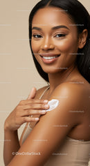 Young Woman Applying Cream for Flawless Skin in Close Up