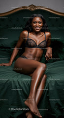 Confident woman smiling in elegant black lingerie on bed