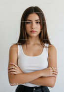 Confident Young Woman Portrait with Crossed Arms in Studio