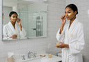 Elegant Woman Applying Gold Eye Patches in Wellness Routine