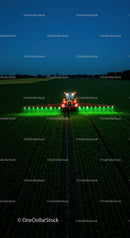 Nighttime Field Work with Modern Farming Equipment