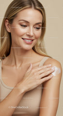 Portrait of a Smiling Woman Applying Lotion on Shoulder for Skincare