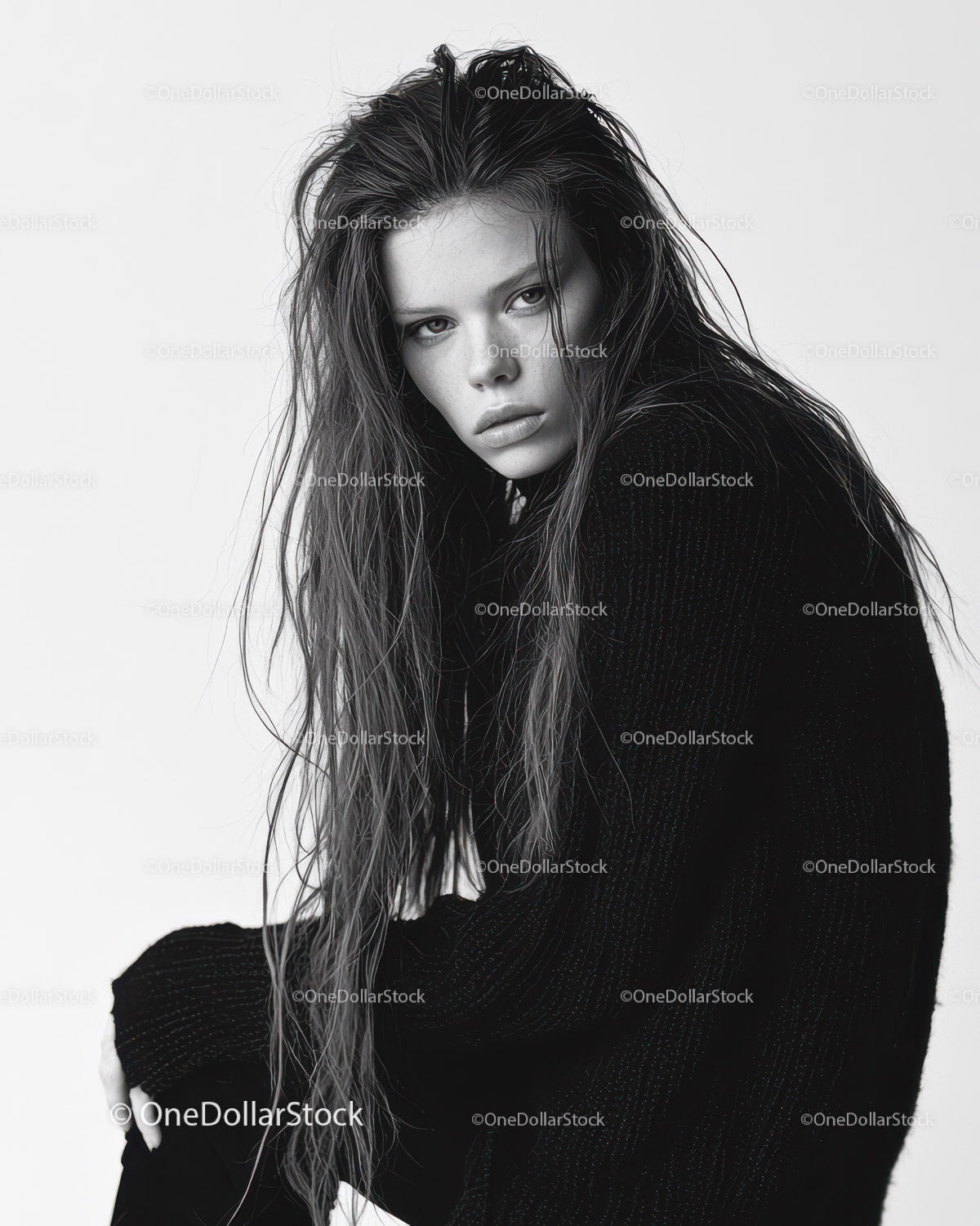 Black and White Portrait of a Woman with Intense Gaze and Wet Hair