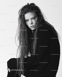 Black and White Portrait of a Woman with Intense Gaze and Wet Hair