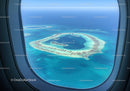Aerial View of a Stunning Circular Atoll with Clear Blue Water