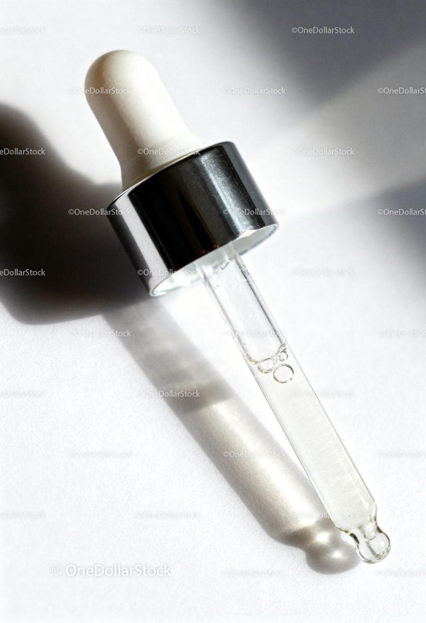 Close up of skincare dropper with serum liquid