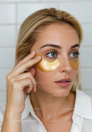 Women Applying Gold Facial Mask for Skin Rejuvenation and Beauty