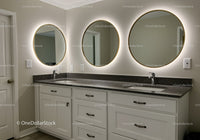 Modern Bathroom with Illuminated Round Mirrors and Double Vanity