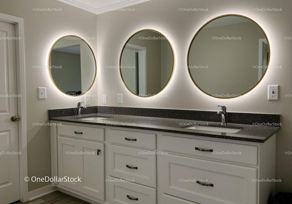 Modern Bathroom with Illuminated Round Mirrors and Double Vanity