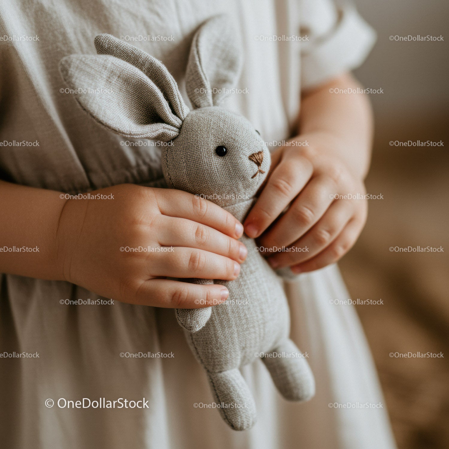 Child Holding Soft Linen Bunny Toy Close Up