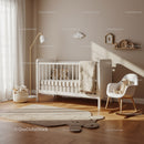 Minimalist Cozy Nursery with White Crib and Soft Toys