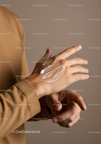 Close-Up of Hand Applying Lotion for Skin Care and Moisturization