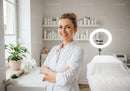 Friendly Female Doctor in Modern Medical Clinic Office
