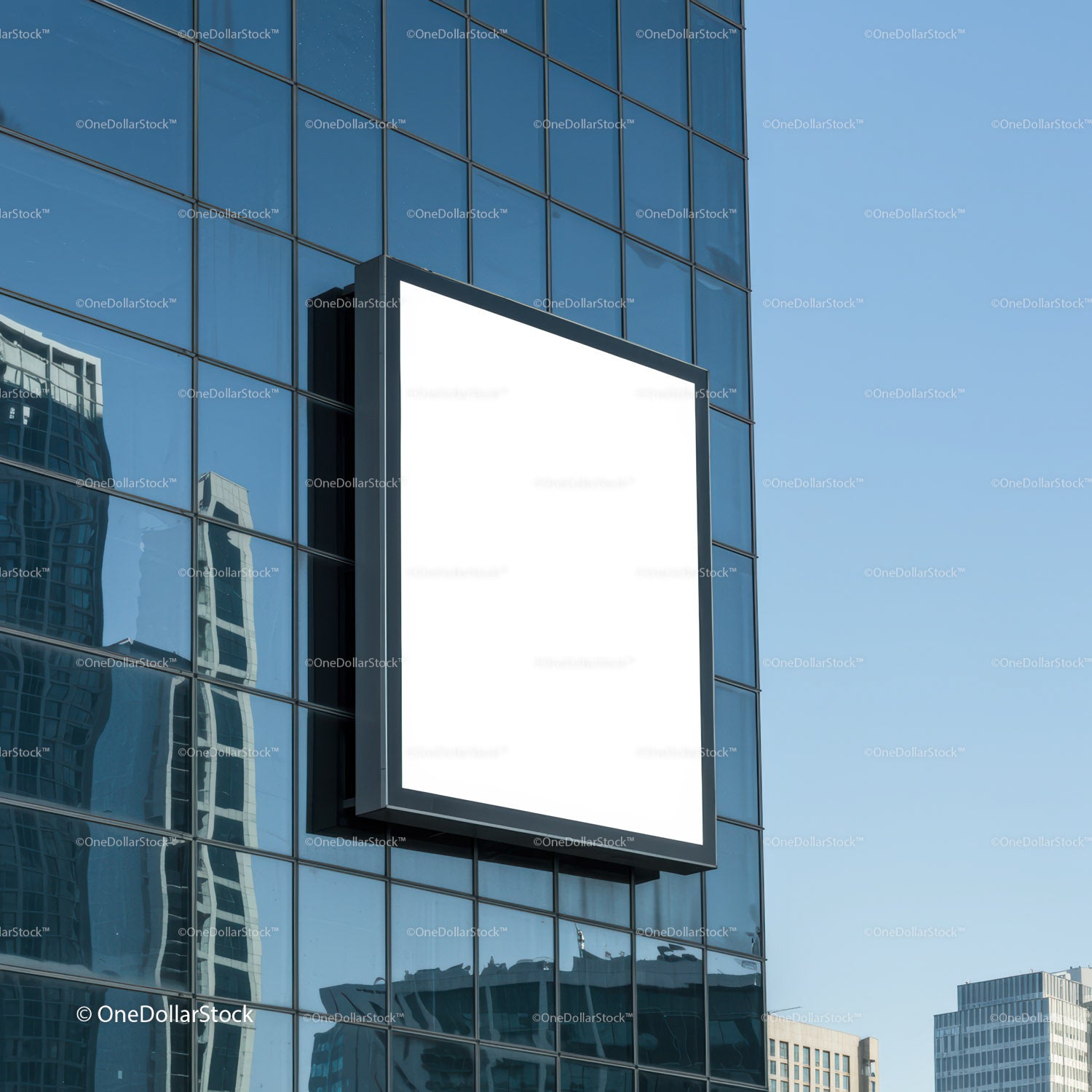 Blank billboard on modern glass office building facade