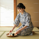 Young woman arranging rice balls in traditional room