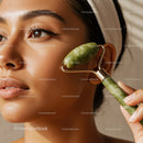 Close Up of Woman Using Jade Roller for Facial Massage in Spa Setting