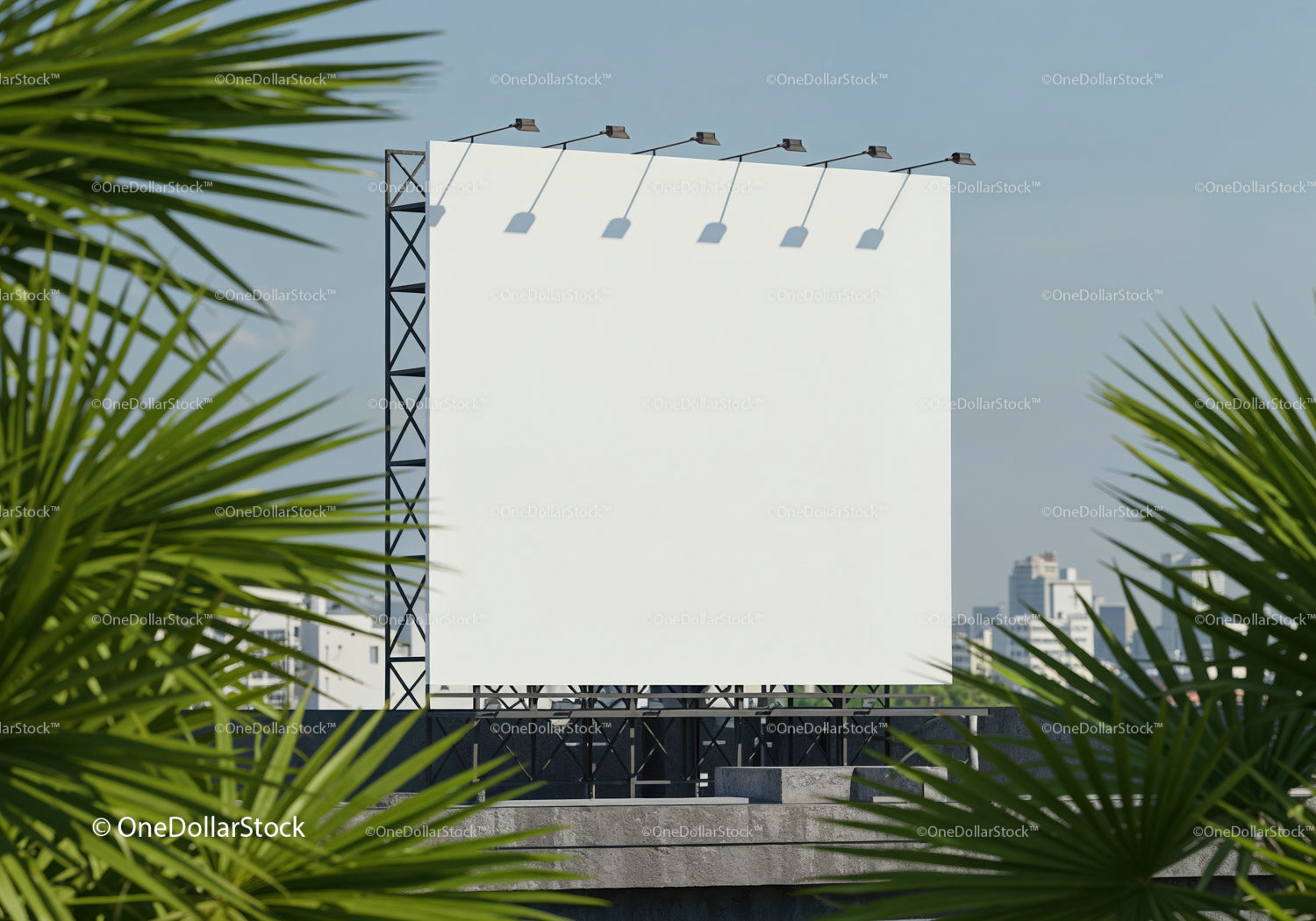 Blank billboard on rooftop framed by palm leaves
