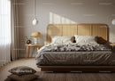 Cozy neutral bedroom with natural light and rattan decor