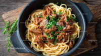 Beef Stew with Pasta in a Black Cast Iron Skillet