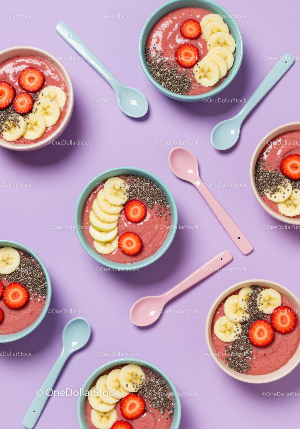 Overhead view of smoothie bowls with fresh fruits and chia seeds
