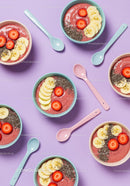 Overhead view of smoothie bowls with fresh fruits and chia seeds