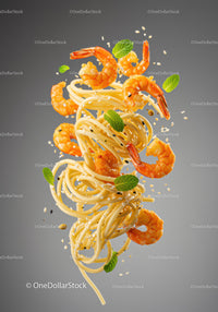 Flying spaghetti and shrimp with fresh mint leaves