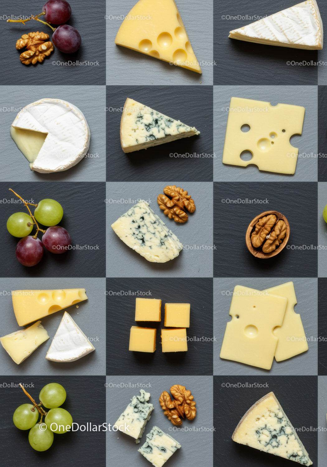 Assorted cheese varieties with grapes and walnuts on slate
