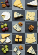 Assorted cheese varieties with grapes and walnuts on slate