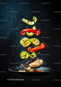 Grilled Vegetables Floating Over Hot Pan with Smoke