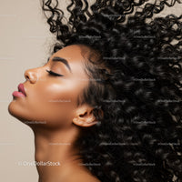Profile of Woman with Natural Curly Hair and Soft Glow