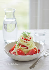 Fresh cucumber salad with grapefruit and pomegranate seeds