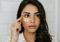 Young Woman Applying Gold Eye Patches for Skincare Beauty