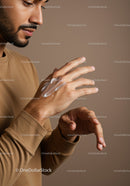 Close-Up of Man Applying Hand Lotion for Skin Care Routine