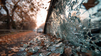 Abandoned Vintage Car with Broken Glass at Sunset