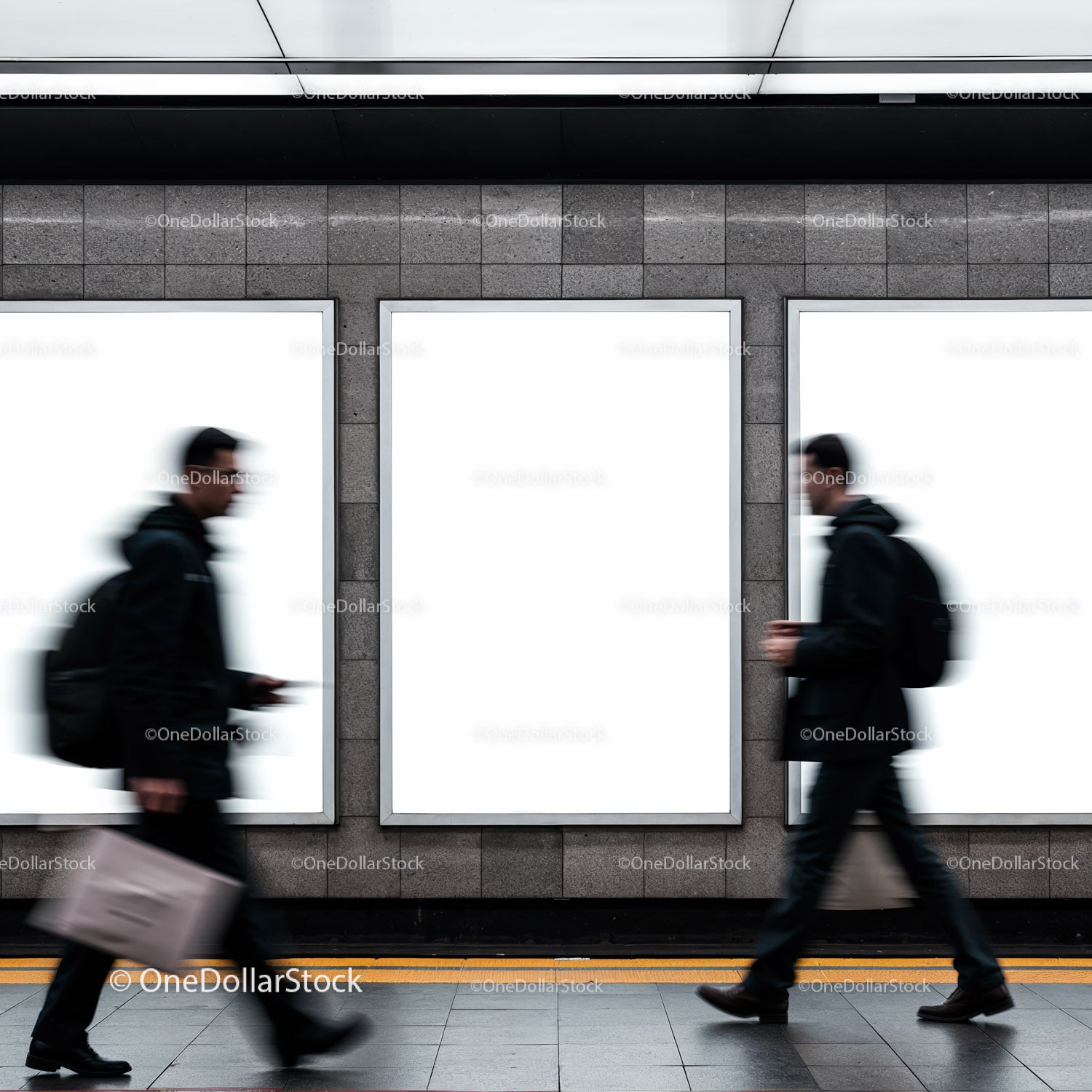 Blurred commuters walking past blank urban advertisements