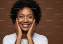 Bright Smiling Woman with Curly Hair in Warm Brown Background