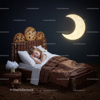 Sleeping Child in Chocolate Bed with Cookie Headboard