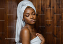 Elegant Woman Relaxing in Spa with White Towel and Wooden Background