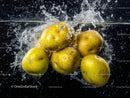 Fresh yellow potatoes submerged in water with bubbles