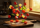 Fresh cherry tomatoes, basil and cheese flying over wooden board