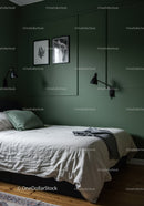 Green Wall Bedroom with Minimalist Decor and Cozy Bed