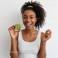 Young Woman Holding Kiwi Fruit with Bright Smile