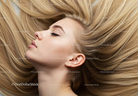 Peaceful young woman with flowing blonde hair lying down