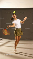 Focused female tennis player preparing to serve ball
