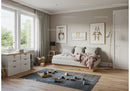 Cozy Children's Bedroom with Wooden Floor and Animal Wall Art