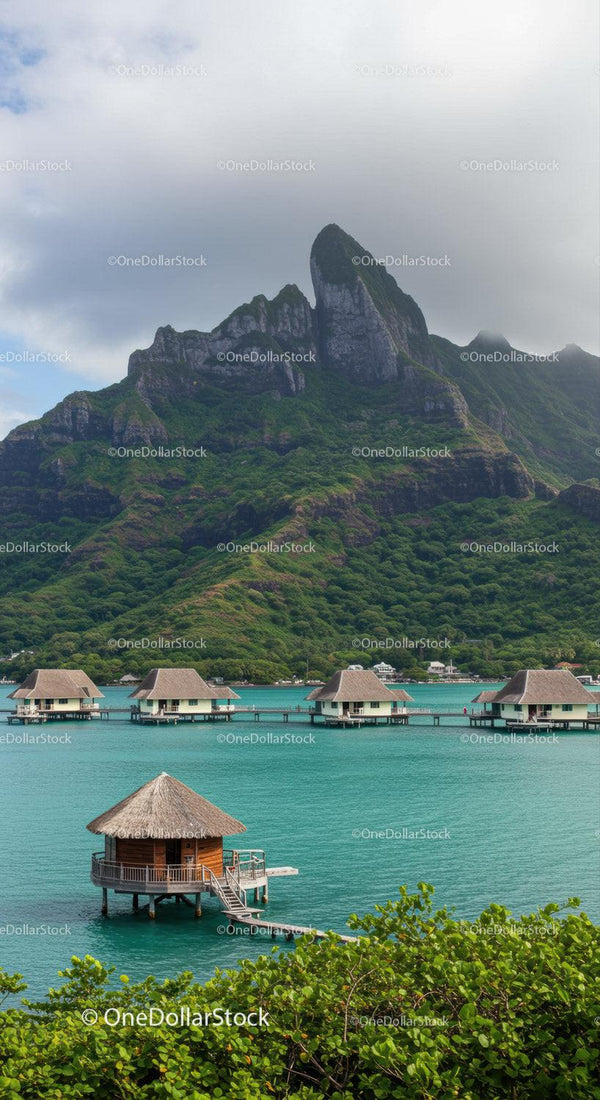 Lush Mountain with Overwater Bungalows and Cloudy Sky