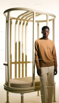 Young man standing beside modern minimalist bench