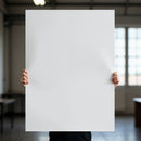 Person Holding Large Blank White Poster Indoors