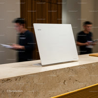 Minimalist white menu stand on stone counter in restaurant