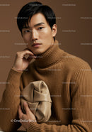 Elegant Male Model in Brown Turtleneck with Beige Clutch for Fashion